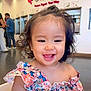 Crystal Hamamura is registered to the contest to win money with this photo: toddler, child, smiling, curly_hair, floral_dress, frozen_yogurt_shop, indoor, happy, person, baby, cute, portrait, fashion, seat, food_place, casual, bright, modern, people, background