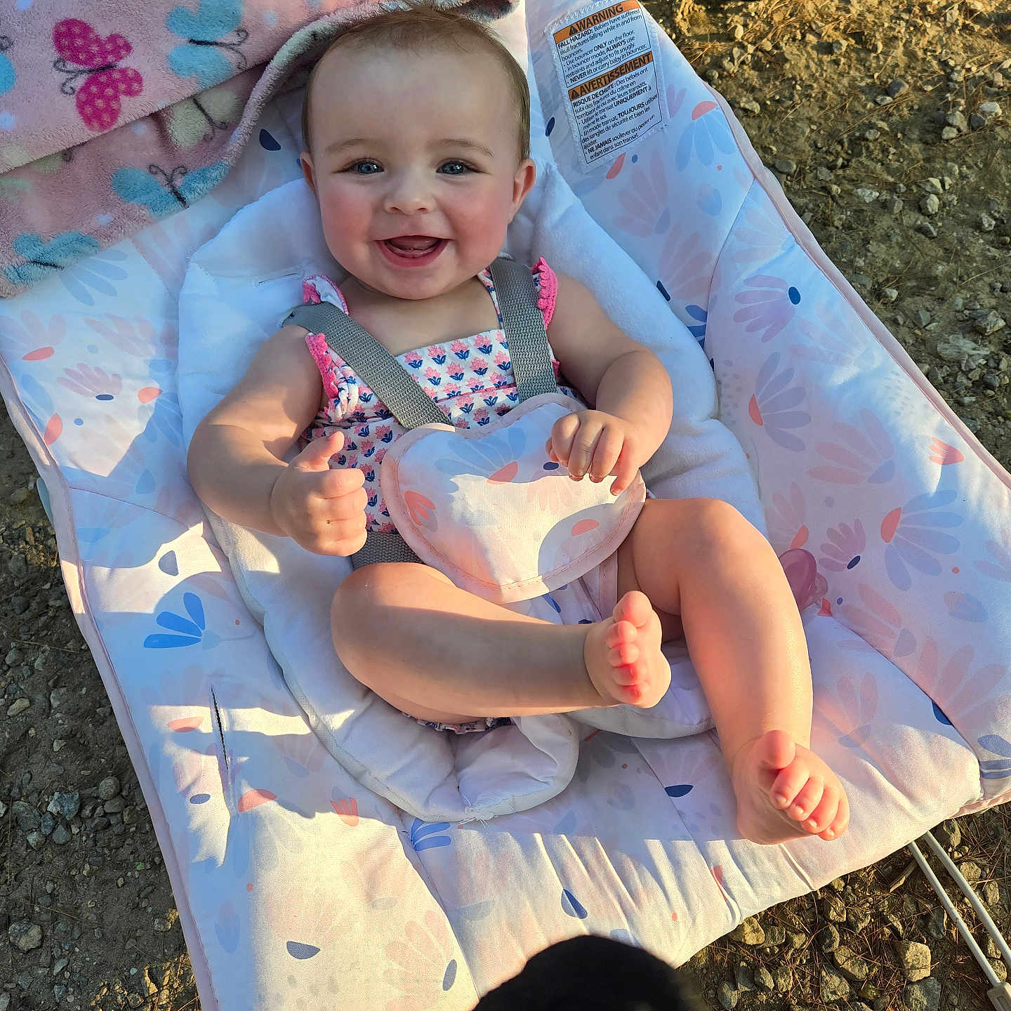 Gianna is registered to the contest to win money with this photo: accessories, baby, bed, blanket, clothing, cutlery, dress, face, furniture, grass, hat, head, outdoors, person, photography, plant, portrait, quilt, strap, stroller
