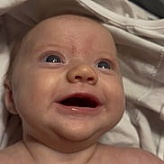 Ariah is registered to the contest to win money with this photo: baby, blue_eyes, child, closeup, cloth, cute, expression, face, happy, head, human, infant, joy, newborn, portrait, skin, smiling, soft, toddler, wrapped