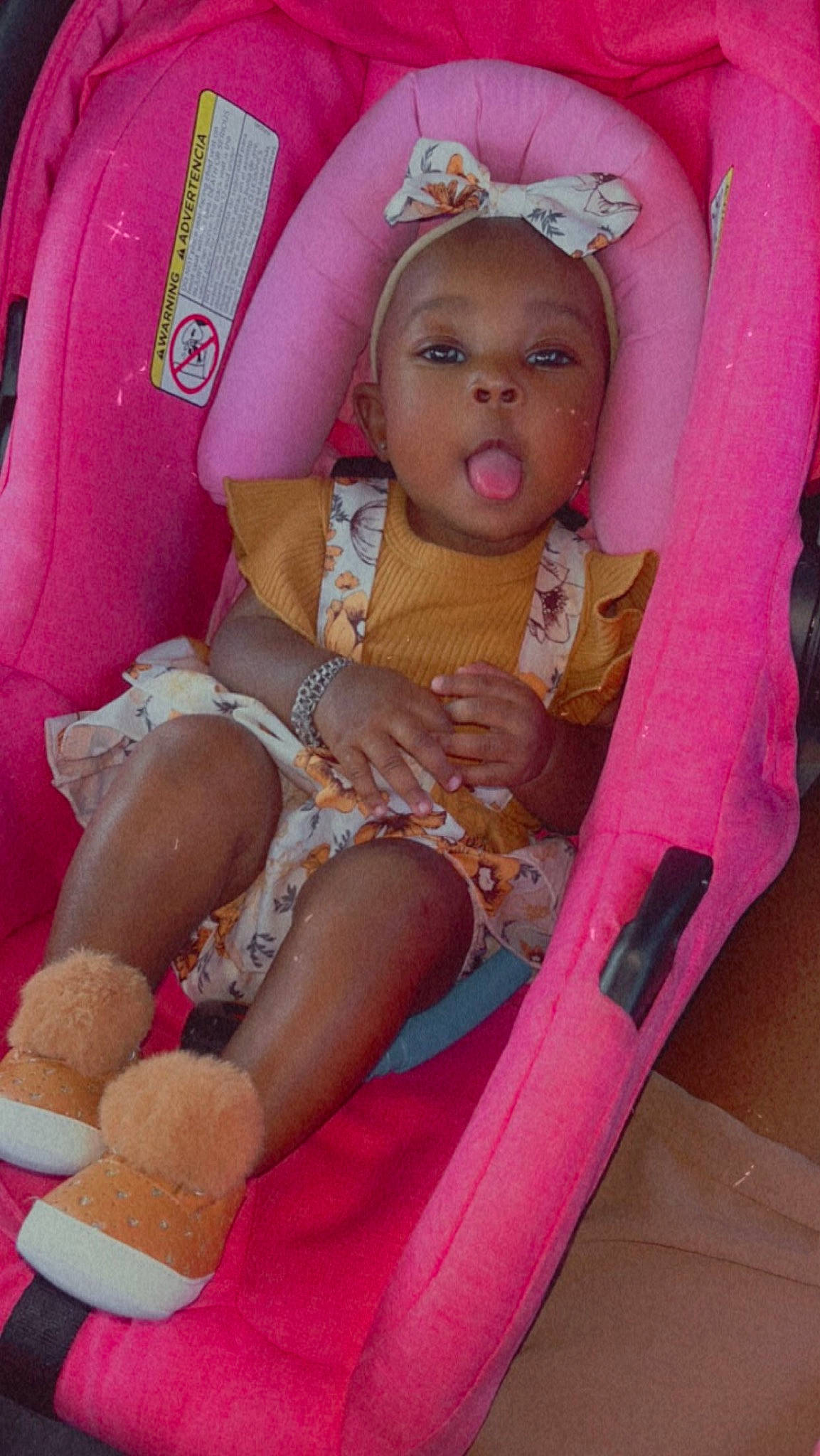 Keyani joined the competition — help win amazing prizes! baby, baby_products, baby_toddler_clothing, car_seat, chair, child, comfort, fun, human_leg, knee, lap, magenta, nail, peach, person, pink, sitting, skin, thigh, toddler