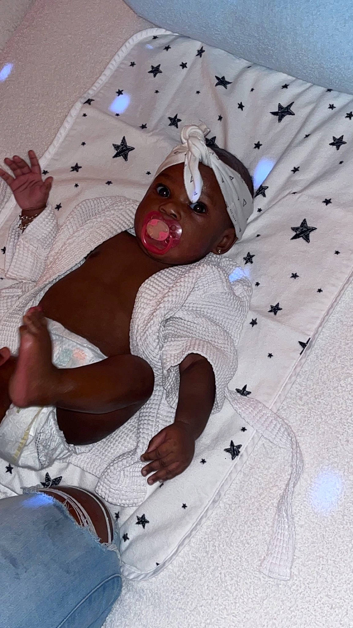 Keyani is registered to the contest to win money with this photo: baby, baby_products, baby_toddler_clothing, bed_sheet, bedding, chest, child, comfort, craft, fashion_design, fictional_character, flesh, fun, human_leg, linens, magenta, pattern, person, textile, thigh