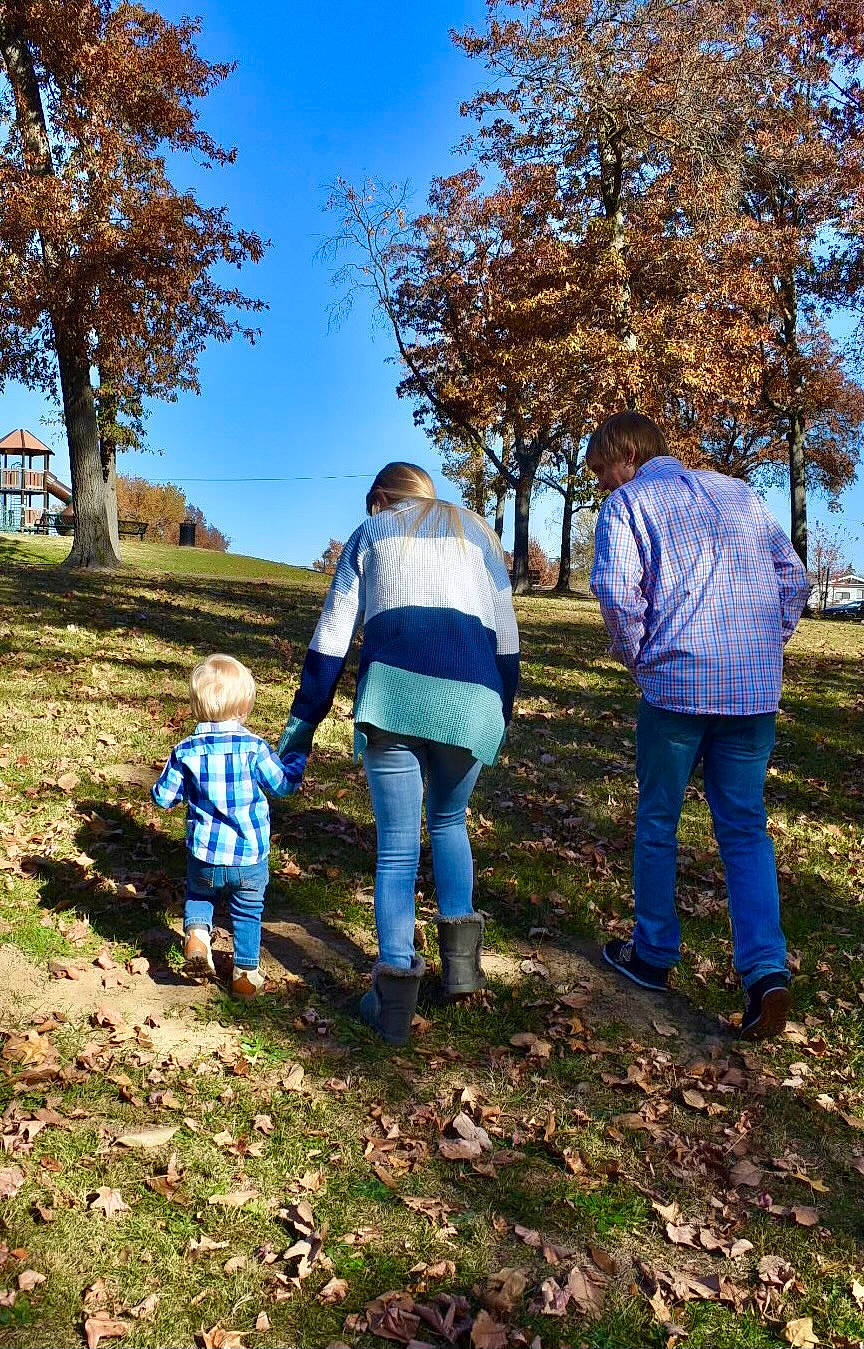 Hayden is registered to the contest to win money with this photo: botany, branch, deciduous, forest, fun, grass, jeans, landscape, leisure, natural_landscape, people_in_nature, person, plant, recreation, sky, soil, sunlight, toddler, tree, twig