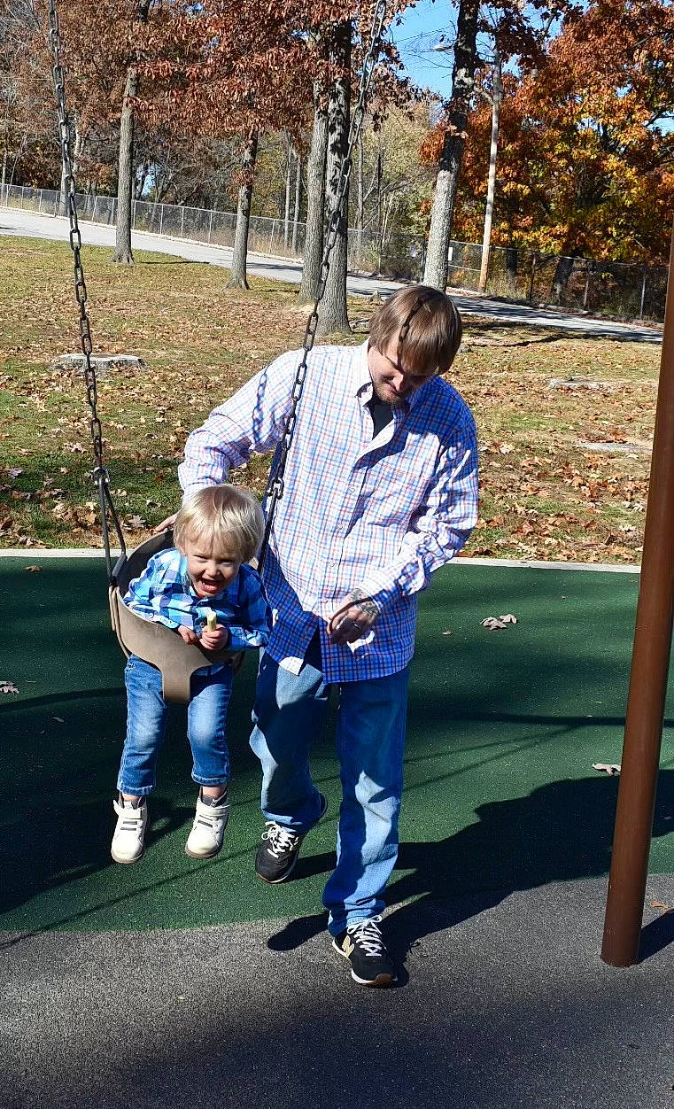 Hayden joined the competition — help win amazing prizes! child, city, denim, electric_blue, fun, gesture, grass, happy, jeans, joy, leisure, outdoor_play_equipment, people_in_nature, person, plant, playground, recreation, sitting, spring, swing