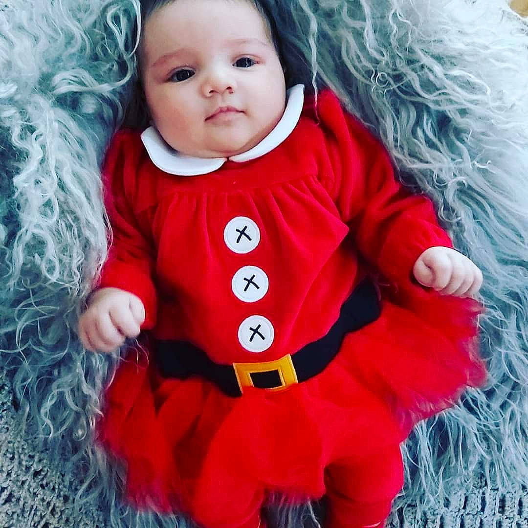 Sofia joined the competition — help win amazing prizes! baby, baby_products, child, christmas, clothing, costume, doll, fictional_character, fur, outerwear, pattern, person, product, red, sleeve, smile, toddler