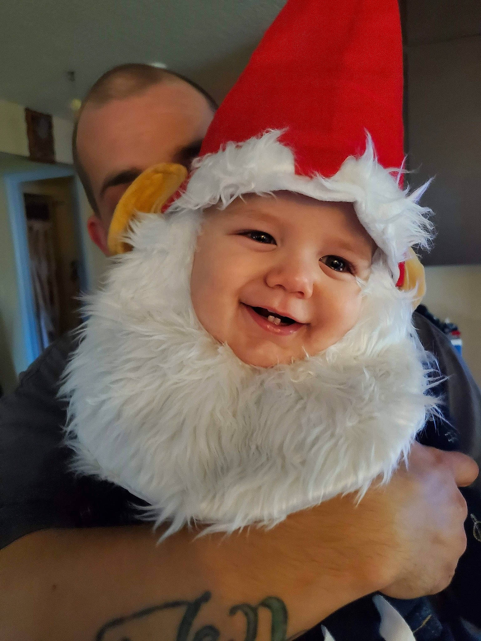 Ezekiel is registered to the contest to win money with this photo: beard, child, christmas, costume, costume_accessory, costume_hat, facial_hair, fictional_character, headwear, joy, party_hat, person, santa_claus, smile, toddler