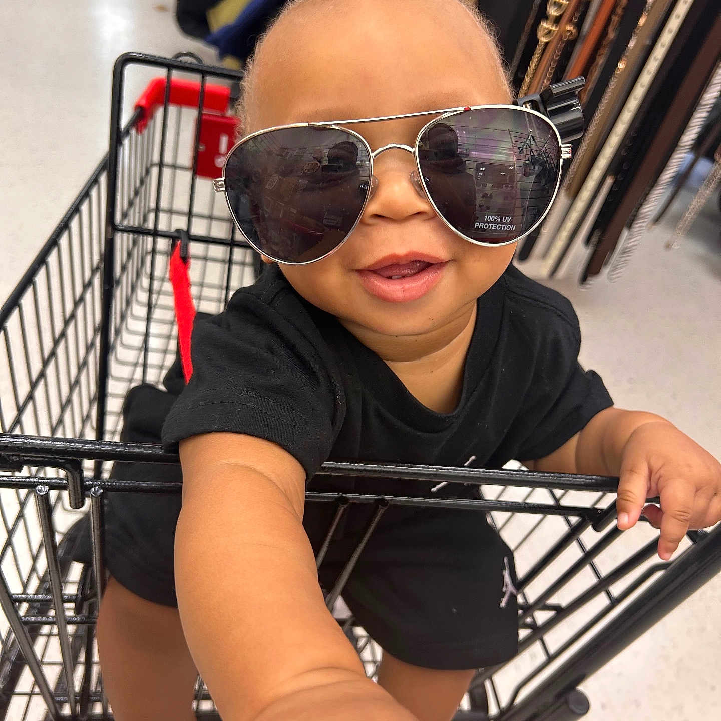 Kavarius joined the competition — help win amazing prizes! accessory, baby, belts, black_clothing, child, cute, face, fashion, hand, happy, head, indoor, mall, person, retail, shopping_cart, smiling, store, sunglasses, toddler