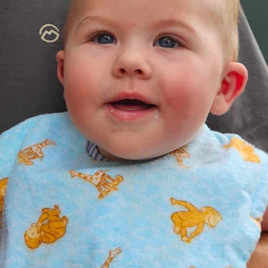 Brayden joined the competition — help win amazing prizes! applique, baby, bib, clothing, face, happy, head, newborn, pattern, person, photography, portrait, quilt, smile, t_shirt