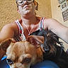 Goliath joined the competition — help win amazing prizes! woman, glasses, dog, pet, indoor, selfie, face, casual, portrait, brown_dog, black_dog, home_decor, wall_art, necklace, tank_top, texture_wall, close_up, relaxed, candid, earbuds