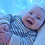 Lenny participe au concours pour gagner de l'argent avec cette photo : baby, blanket, blue_light, cheerful, child, closeup, cozy, cute, face, fairy_lights, hands, happy, indoor, infant, lying_down, portrait, smile, soft_texture, striped_clothing, warm