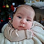 Lenny participe au concours pour gagner de l'argent avec cette photo : baby, blanket, blue_eyes, child, christmas_tree, closeup, cozy, cute, decorations, face, festive, gold_baubles, holiday, indoor, ornaments, person, red_baubles, resting, soft_texture, sweater