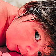 Hana joined the competition — help win amazing prizes! baby, blanket, child, closeup, curious, cute, expression, face, hair, head, indoors, infant, lying_down, newborn, portrait, resting, skin, sleepy, soft_texture, young