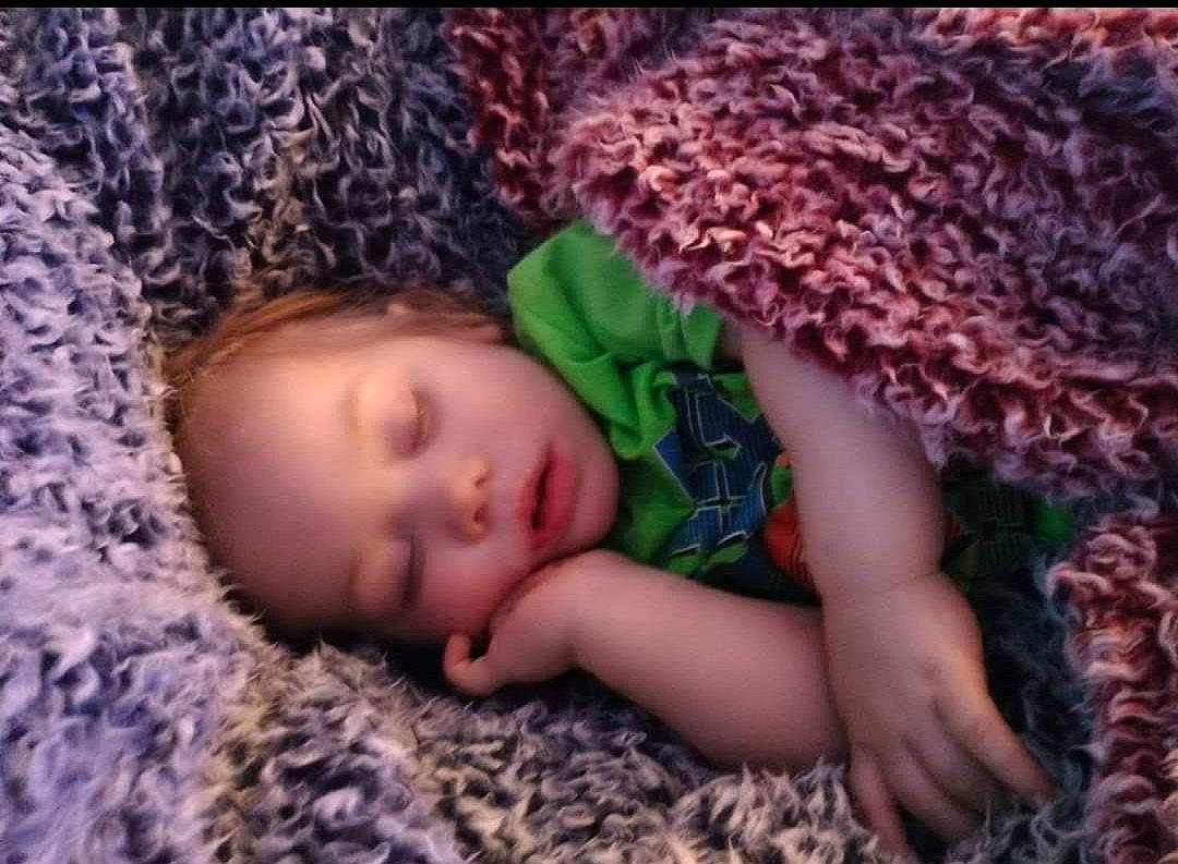 Valkyrie is registered to the contest to win money with this photo: baby, baby_sleeping, baby_toddler_clothing, bedtime, child, comfort, eye, face, fur, grass, head, iris, knit_cap, linens, nap, pattern, person, skin, thumb, toddler