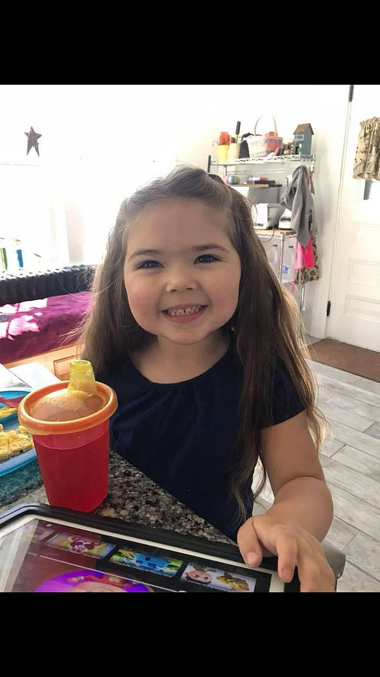 Elise is registered to the contest to win money with this photo: child, dessert, hardwood, joy, laminate_flooring, person, smile, snack, sweetness, toddler, wood_flooring, wood_stain