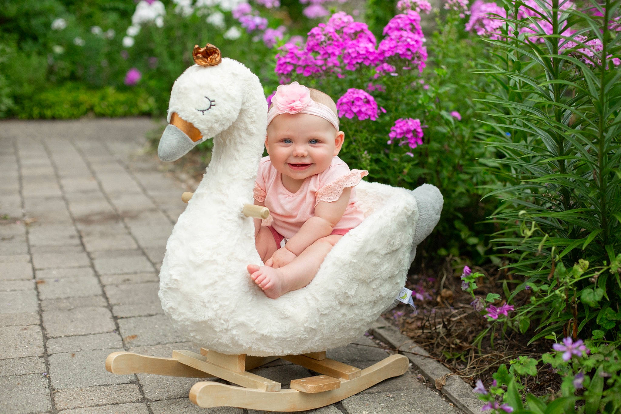 Melina joined the competition — help win amazing prizes! annual_plant, baby, botany, child, dress, eye, flower, fun, grass, happy, hat, head, headwear, joy, lawn_ornament, leisure, people_in_nature, person, petal, pink