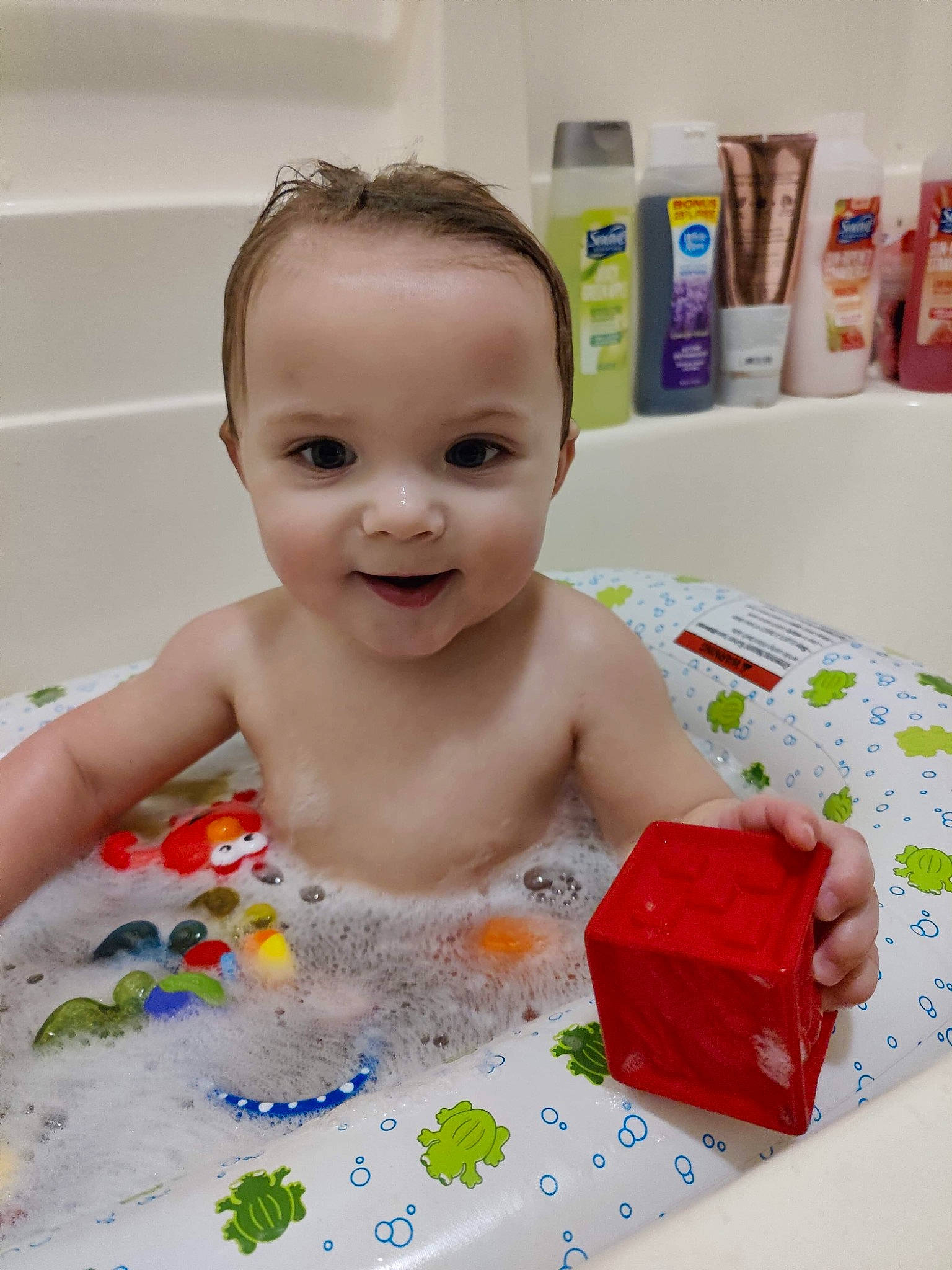 Jason is registered to the contest to win money with this photo: baby, baby_bathing, baby_playing_with_toys, baby_products, baby_toddler_clothing, baby_toys, bathing, bathroom, bathtub, chest, child, face, fun, happy, joy, leisure, person, play, room, skin