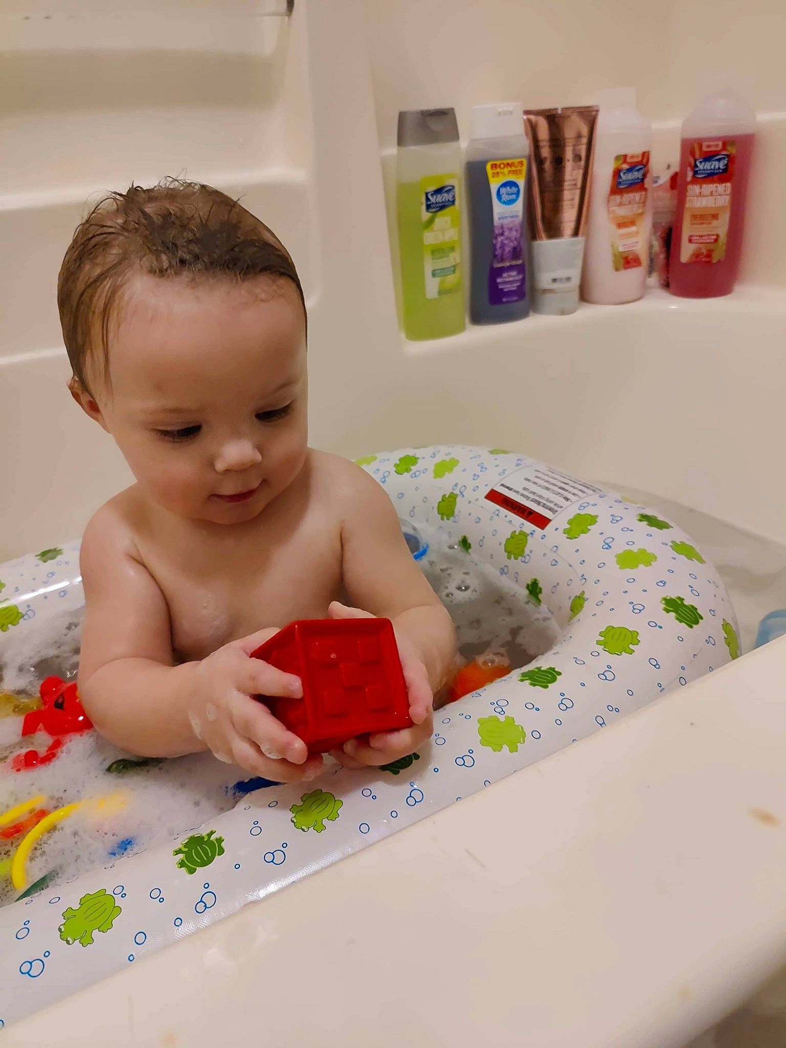 Jason is registered to the contest to win money with this photo: baby, baby_playing_with_toys, baby_products, baby_toddler_clothing, bathing, bathroom, chest, child, finger, flooring, fun, happy, household_supply, leisure, paper_product, person, play, product, room, sitting