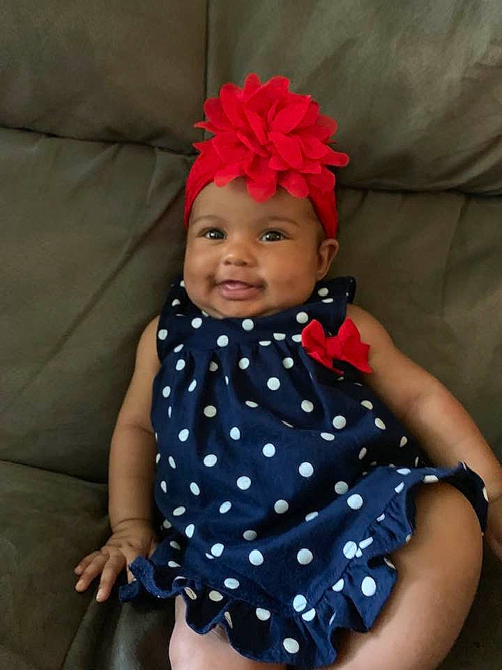 Jaylee is registered to the contest to win money with this photo: baby, baby_products, baby_toddler_clothing, child, child_model, clothing, costume_accessory, design, fashion_accessory, hair_accessory, headband, headgear, joy, pattern, person, polka_dot, product, red, textile, toddler