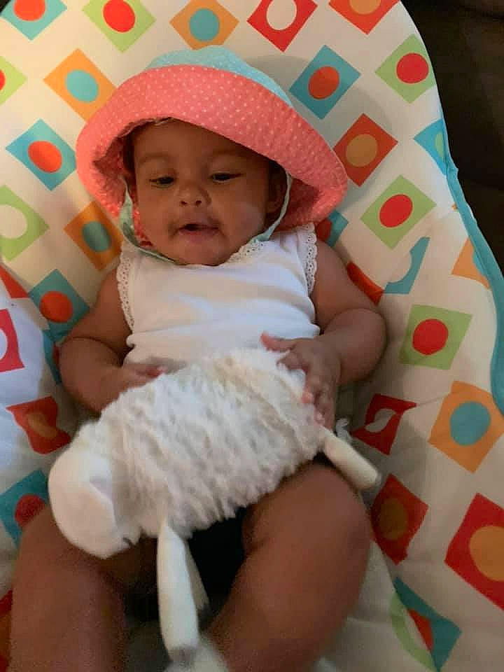 Jaylee joined the competition — help win amazing prizes! baby, baby_products, baby_toddler_clothing, bonnet, child, headgear, headwear, person, product, skin, smile, toddler