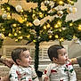 baby, babies, child, christmas_tree, christmas_lights, christmas_ornaments, pajamas, holiday, festive, indoor, carpet, smiling, happy, sitting, family, celebration, decorations, cute, toddler, infant