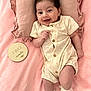 Olivia Jade joined the competition — help win amazing prizes! baby, infant, smiling, lying_down, pillow, blanket, romper, socks, cute, milestone, two_months, wooden_plaque, soft_texture, pink, cream_color, happy, portrait, child, small_hands, frilly_socks