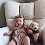 Arrow Saige joined the competition — help win amazing prizes! baby, child, infant, headband, plush_toy, stuffed_bear, armchair, beige_outfit, textured_clothing, cozy, indoor, cute, smiling, person, soft_fabric, furniture, relaxed, seated, home, portrait