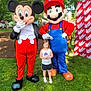 character, child, costume, cute, daytime, event, fun, grass, greenery, happy, mario, mascot, mickey_mouse, outdoor, park, people, photography, smiling, summer, tree