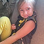 Destiny joined the competition — help win amazing prizes! child, smiling, couch, yellow_pants, blue_top, embroidery, indoor, happy, face, person, furniture, cozy, light, living_room, casual_clothing, seated, young_girl, hair, comfort, relaxed