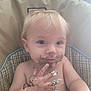 baby, blonde_hair, blue_eyes, cake, child, cream, curious, face, fingers, food, hand, high_chair, indoor, messy, portrait, sitting, skin, smudged, toddler, young_child