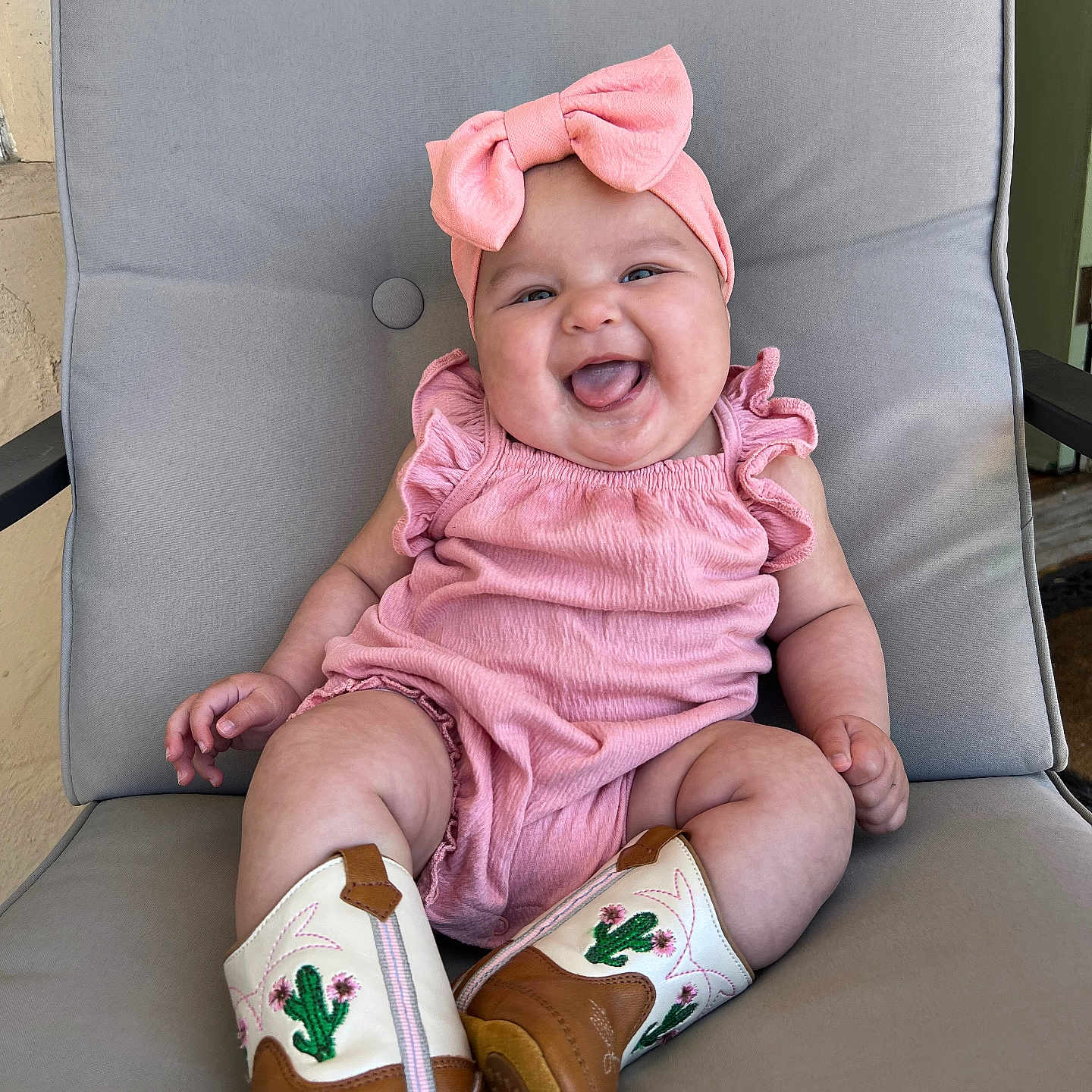 Topanga joined the competition — help win amazing prizes! baby, babylaughing, boot, chair, clothing, couch, cushion, face, footwear, furniture, happy, hat, head, homedecor, laughing, person, photography, portrait, shoe, sitting