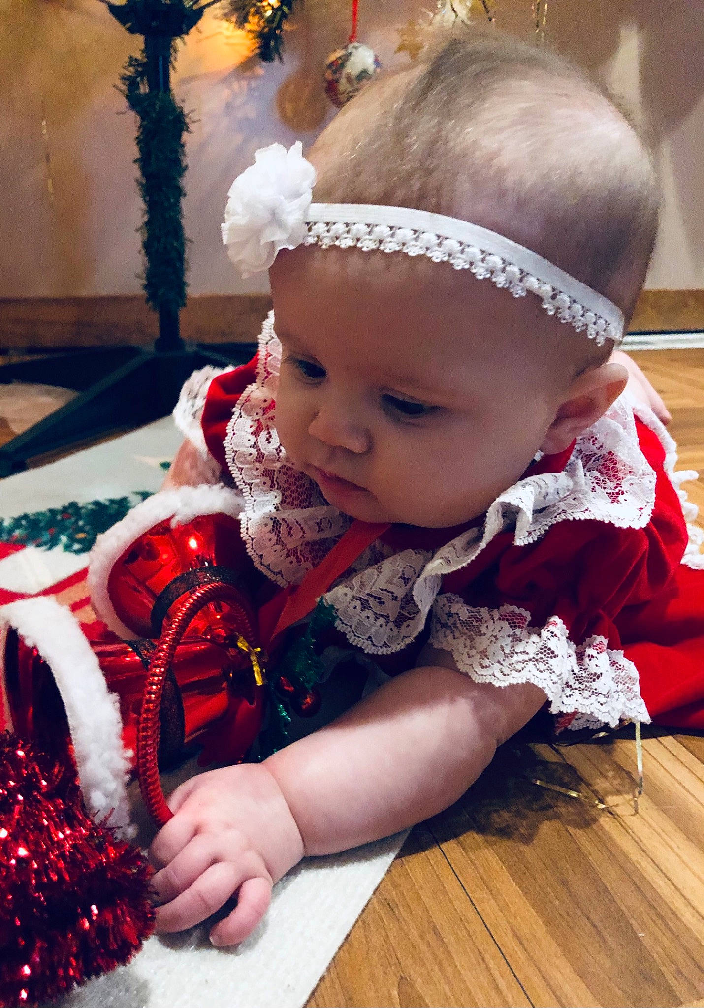 Iylah joined the competition — help win amazing prizes! baby, baby_toddler_clothing, cheek, child, event, facial_expression, fashion_accessory, flooring, headband, headgear, headpiece, iris, magenta, pattern, person, pink, red, sitting, skin, toddler