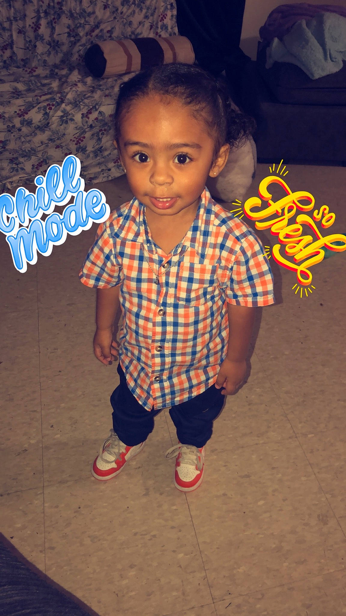 Jahiem is registered to the contest to win money with this photo: arm, baby_toddler_clothing, cheek, child, chin, cool, design, electric_blue, fashion_design, flash_photography, flooring, fun, happy, pattern, person, plaid, skin, sleeve, standing, t_shirt