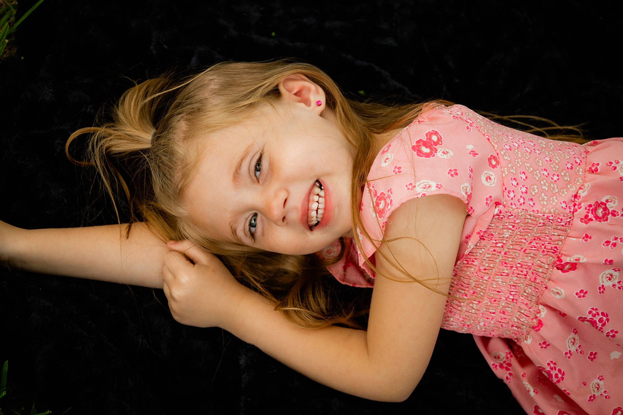 Teagan joined the competition — help win amazing prizes! arm, cheek, dress, eye, face, facial_expression, flash_photography, fun, grass, hand, happy, human_body, iris, joy, lip, nose, person, pink, plant, shoulder