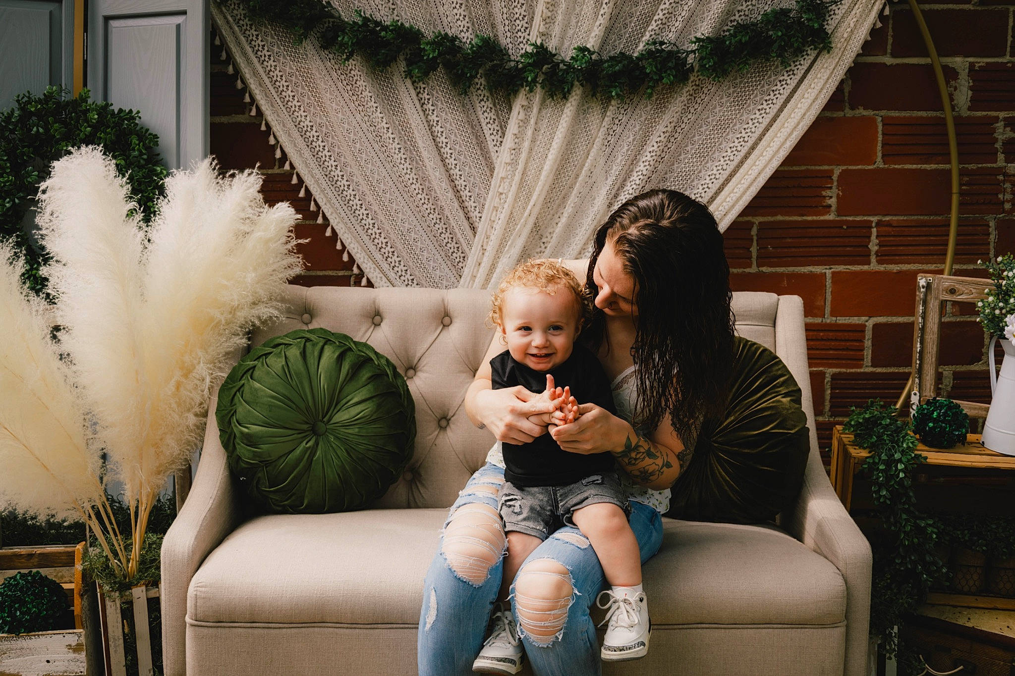 Emory is registered to the contest to win money with this photo: baby, child, comfort, couch, event, flash_photography, flowerpot, fun, grass, happy, houseplant, joy, leisure, living_room, people, person, plant, room, sitting, sofa_bed