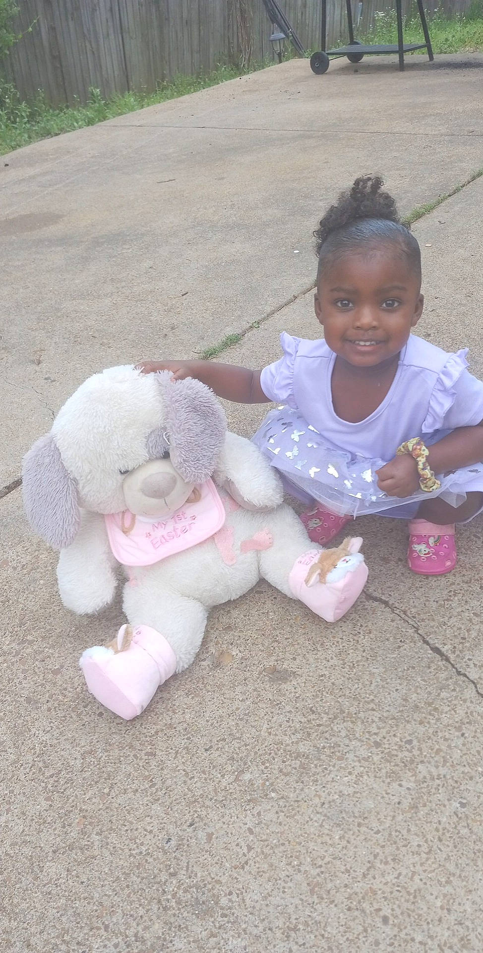 Cali joined the competition — help win amazing prizes! baby_toddler_clothing, fawn, fun, gesture, grass, happy, head, joy, leisure, person, pink, play, plush, recreation, sitting, skin, smile, t_shirt, teddy_bear, thumb