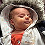 Iannis participe au concours pour gagner de l'argent avec cette photo : baby, newborn, infant, sleeping, hood, fur_trim, jacket, onesie, striped_lining, blanket, close_up, portrait, cheeks, peaceful, soft, skin, zipper, fabric, smile, cozy