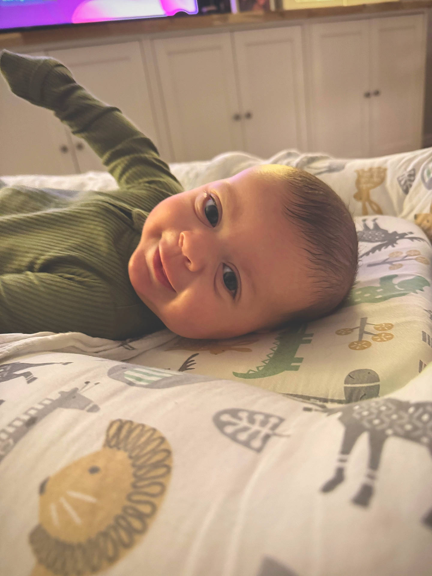 baby, bed, bedroom, bodypart, clothing, face, finger, furniture, glove, hand, happy, head, homedecor, indoors, newborn, person, photography, portrait, room, smile