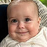 Will is registered to the contest to win money with this photo: baby, smile, face, chubby_cheeks, eyes, infant, clothing, shirt, wicker, background, portrait, cute, happy, child, young, skin, head, expression, indoors, closeup