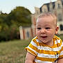 Jed participe au concours pour gagner de l'argent avec cette photo : baby, blanket, blurred_background, building, candid, casual_clothing, child, cute, daylight, face, grass, happy, nature, outdoor, portrait, sitting, smiling, striped_clothing, yellow_shirt, young_child