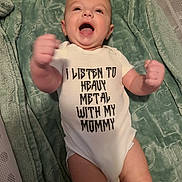 Oliver joined the competition — help win amazing prizes! baby, blanket, child, clothing, cute, fabric, face, fist, green, happy, indoor, infant, lying_down, newborn, onesie, person, playful, smiling, soft_texture, text