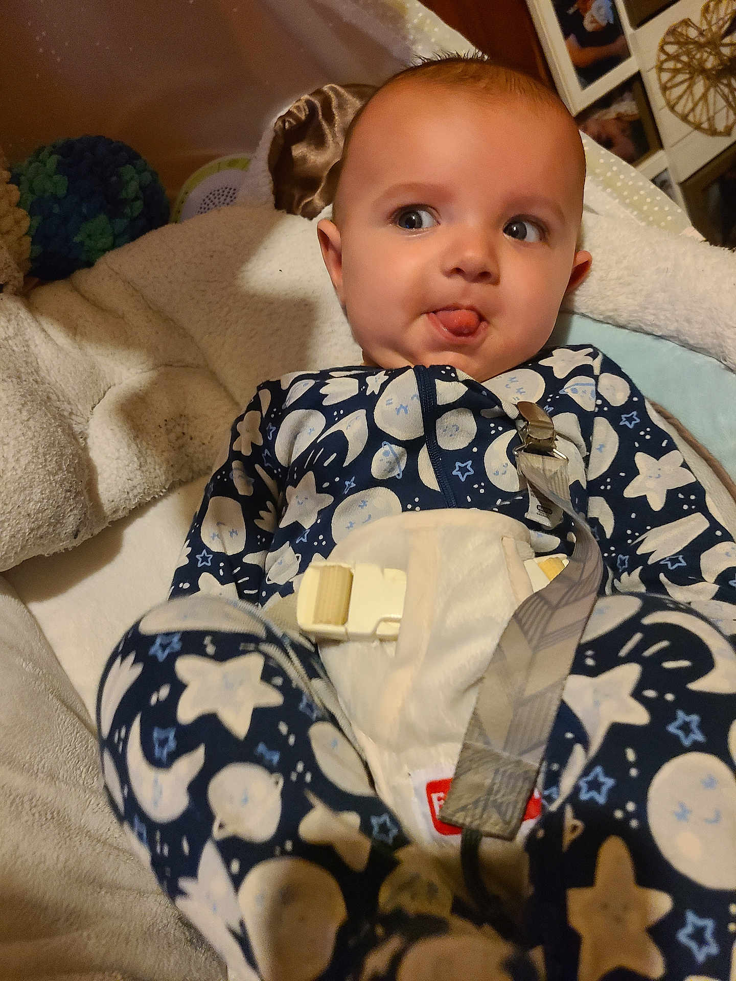 Oliver joined the competition — help win amazing prizes! baby, infant, onesie, stars, moon, blanket, face, tongue, expression, cozy, indoor, child, clothing, soft, cushion, person, portrait, smile, home, decor