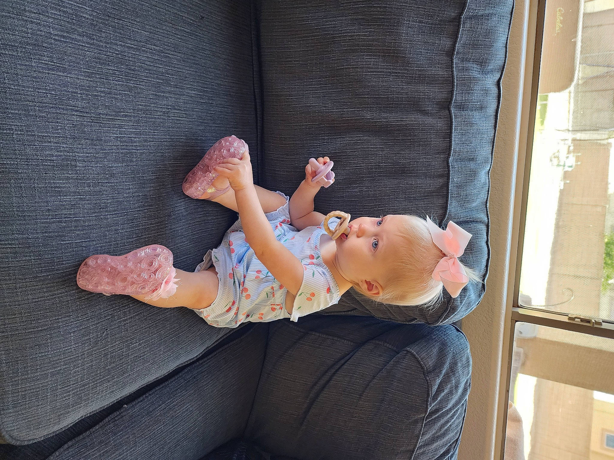 Bailey is registered to the contest to win money with this photo: abdomen, barefoot, comfort, couch, elbow, event, finger, flash_photography, foot, happy, human_leg, knee, leisure, person, room, sitting, thigh, toddler, tree, trunk