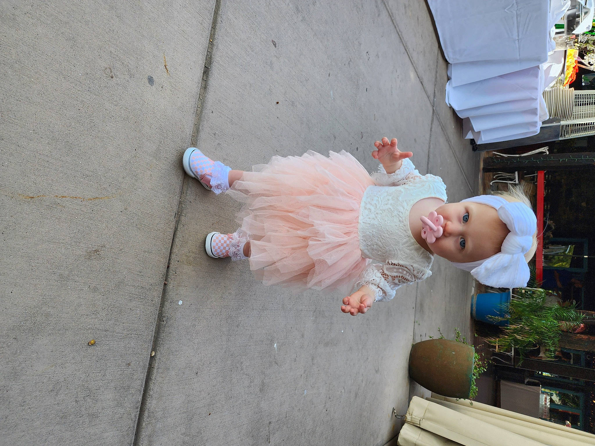 Bailey joined the competition — help win amazing prizes! asphalt, child, concrete, event, foot, fun, grass, human_leg, leisure, person, plant, road, road_surface, sandal, sidewalk, street