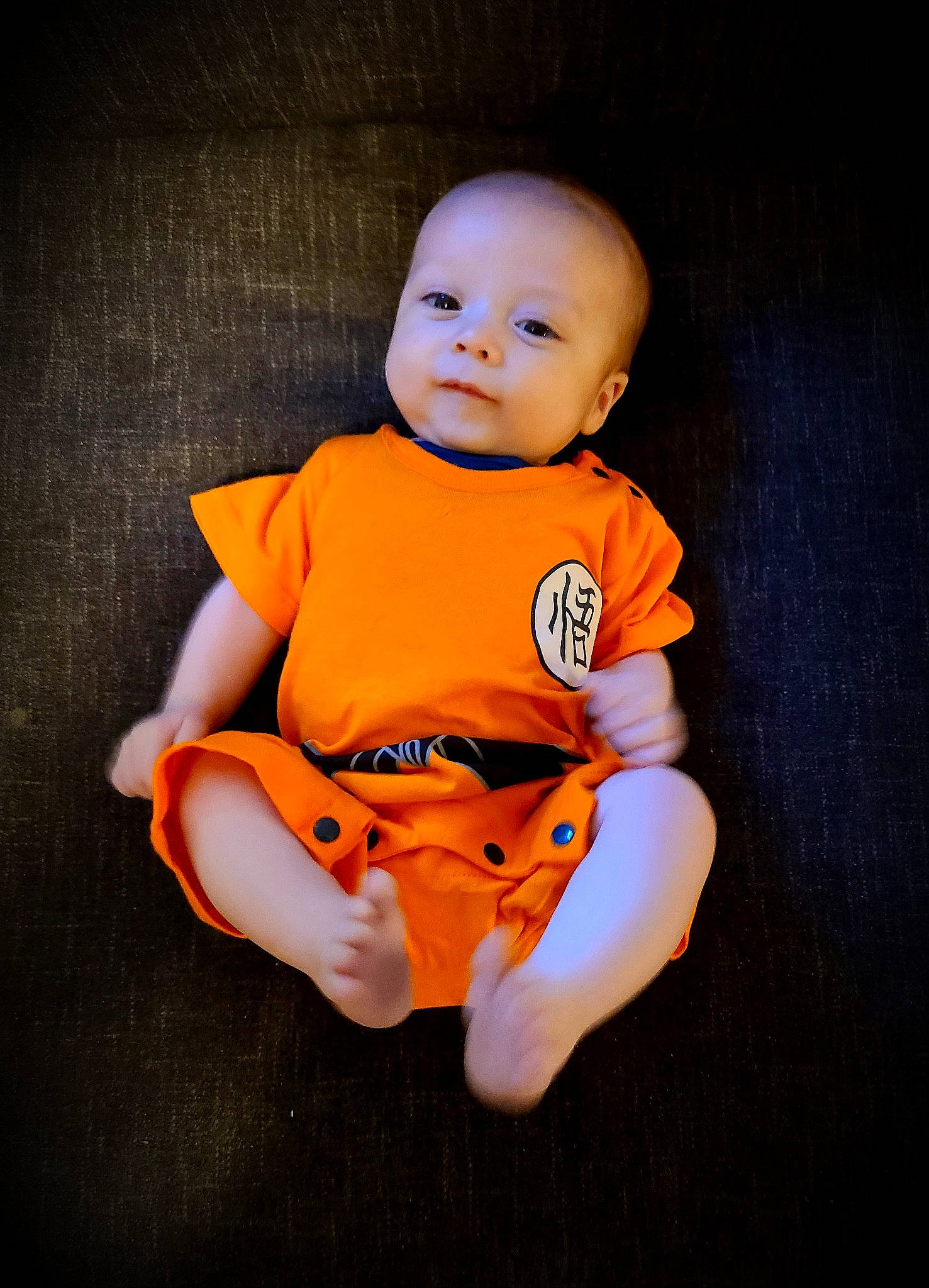 Gerald joined the competition — help win amazing prizes! arm, baby, baby_toddler_clothing, cheek, child, flash_photography, orange, person, photography, sitting, skin, sleeve, smile, t_shirt, toddler, yellow