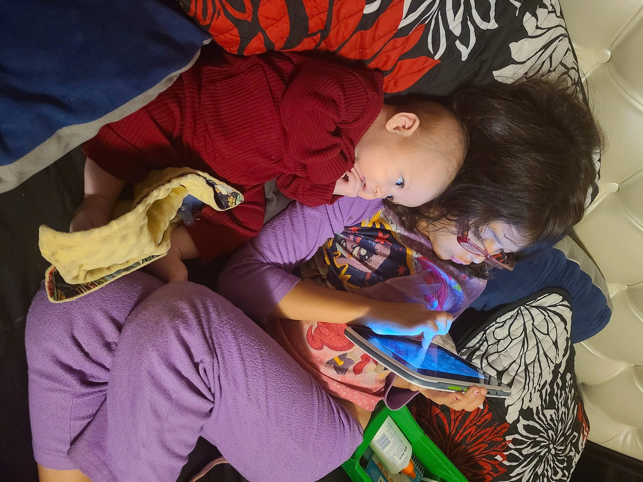 Gerald is registered to the contest to win money with this photo: black_hair, child, cool, happy, human, interaction, love, nap, person, play, sleep, smile, snapshot, t_shirt, textile, toddler