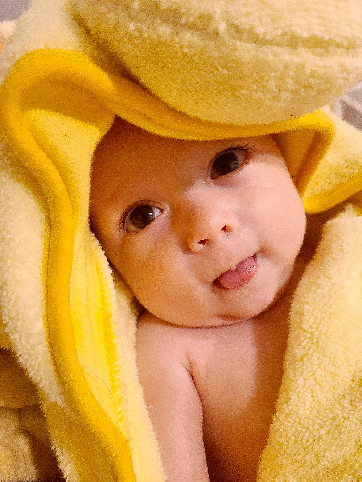 Gerald is registered to the contest to win money with this photo: baby, cheek, child, face, hat, headgear, headwear, lip, mouth, nose, person, skin, smile, toddler, yellow