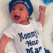 Adam Iven joined the competition — help win amazing prizes! baby, infant, smiling, hat, blue_clothing, white_onesie, toy, stuffed_animal, teddy_bear, plush_star, blanket, carpet, child, cute, happy, lying_down, indoors, portrait, newborn, baby_clothes