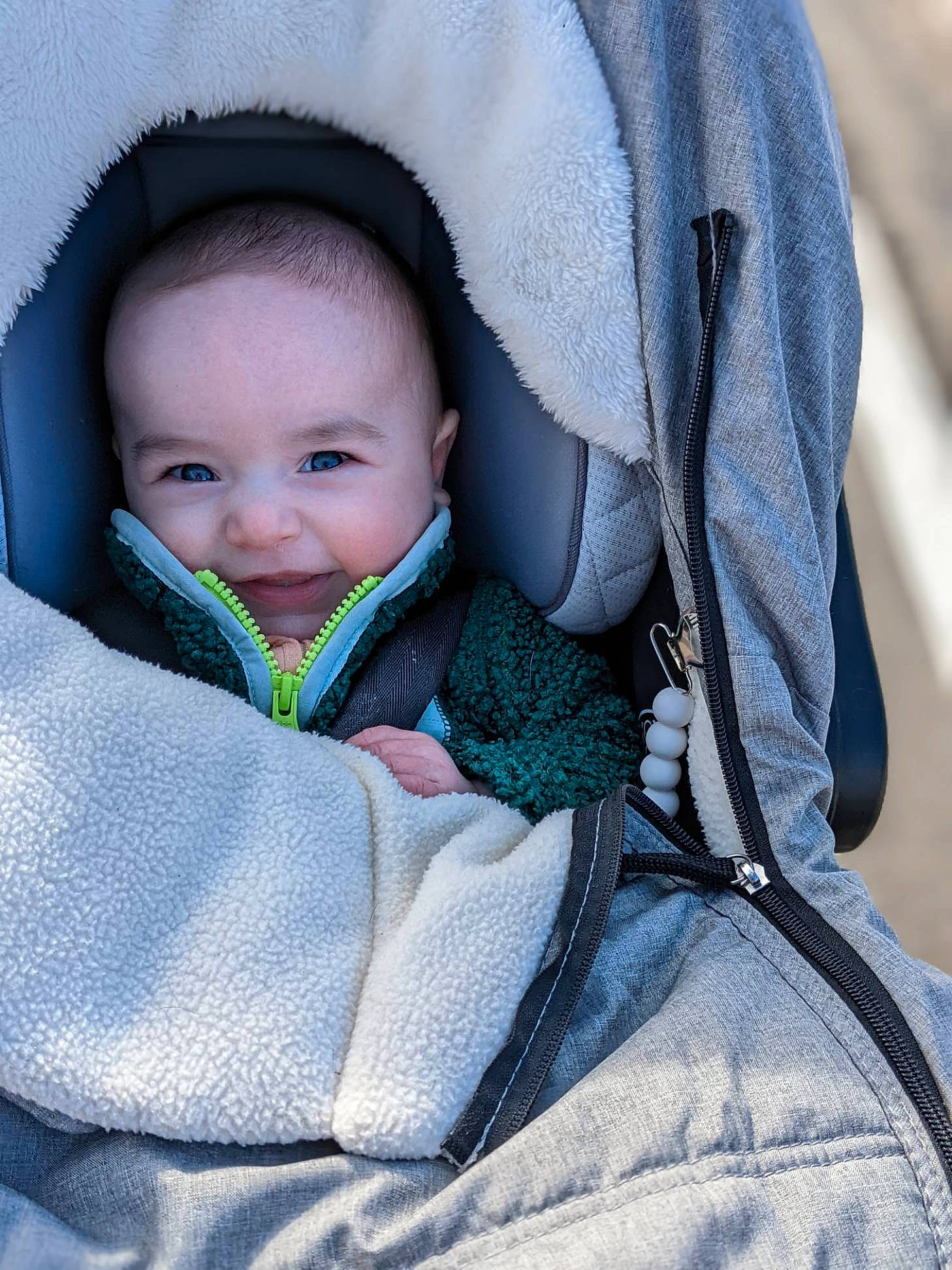 Lochlan is registered to the contest to win money with this photo: azure, baby, baby_carriage, baby_products, baby_toddler_clothing, beauty, cheek, child, comfort, electric_blue, grey, iris, linens, outerwear, person, sitting, skin, sleeve, smile, textile