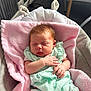Oaklynn is registered to the contest to win money with this photo: baby, sleeping, blanket, pink, mint_green, infant, baby_seat, soft_texture, clothing, indoor, face, hand, resting, cute, child, cozy, newborn, furniture, room, relax