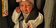 Oaklynn joined the competition — help win amazing prizes! baby, infant, car_seat, headband, bow, white_clothing, straps, safety, cute, smiling, tongue_out, child, newborn, seat, black, green, fabric, comfort, indoors, portrait