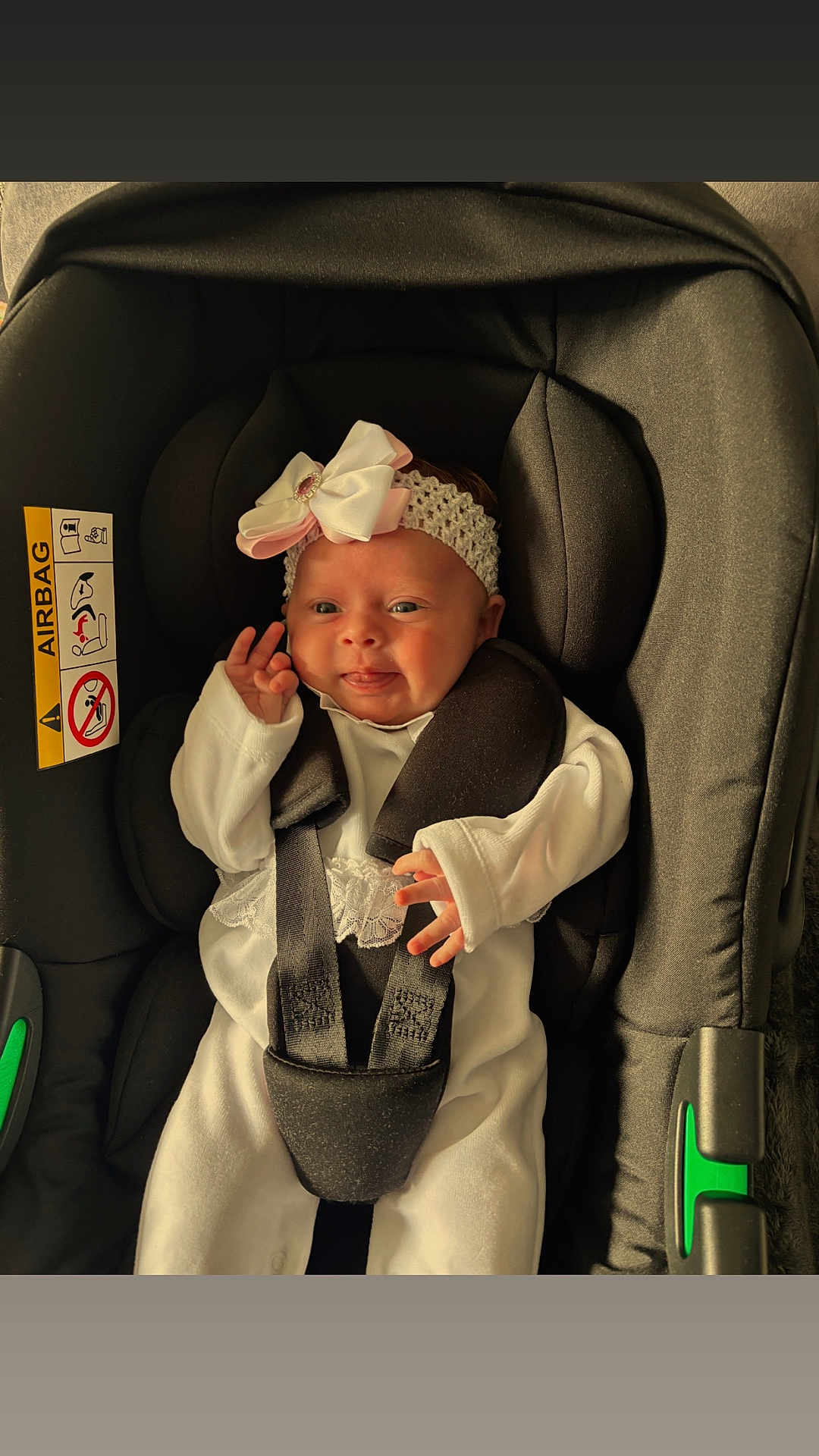 Oaklynn joined the competition — help win amazing prizes! baby, infant, car_seat, headband, bow, white_clothing, straps, safety, cute, smiling, tongue_out, child, newborn, seat, black, green, fabric, comfort, indoors, portrait